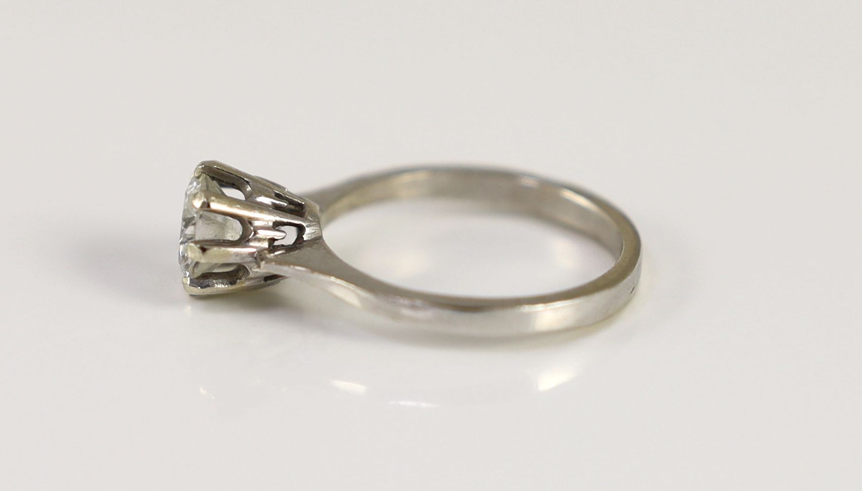 A white gold and solitaire diamond ring